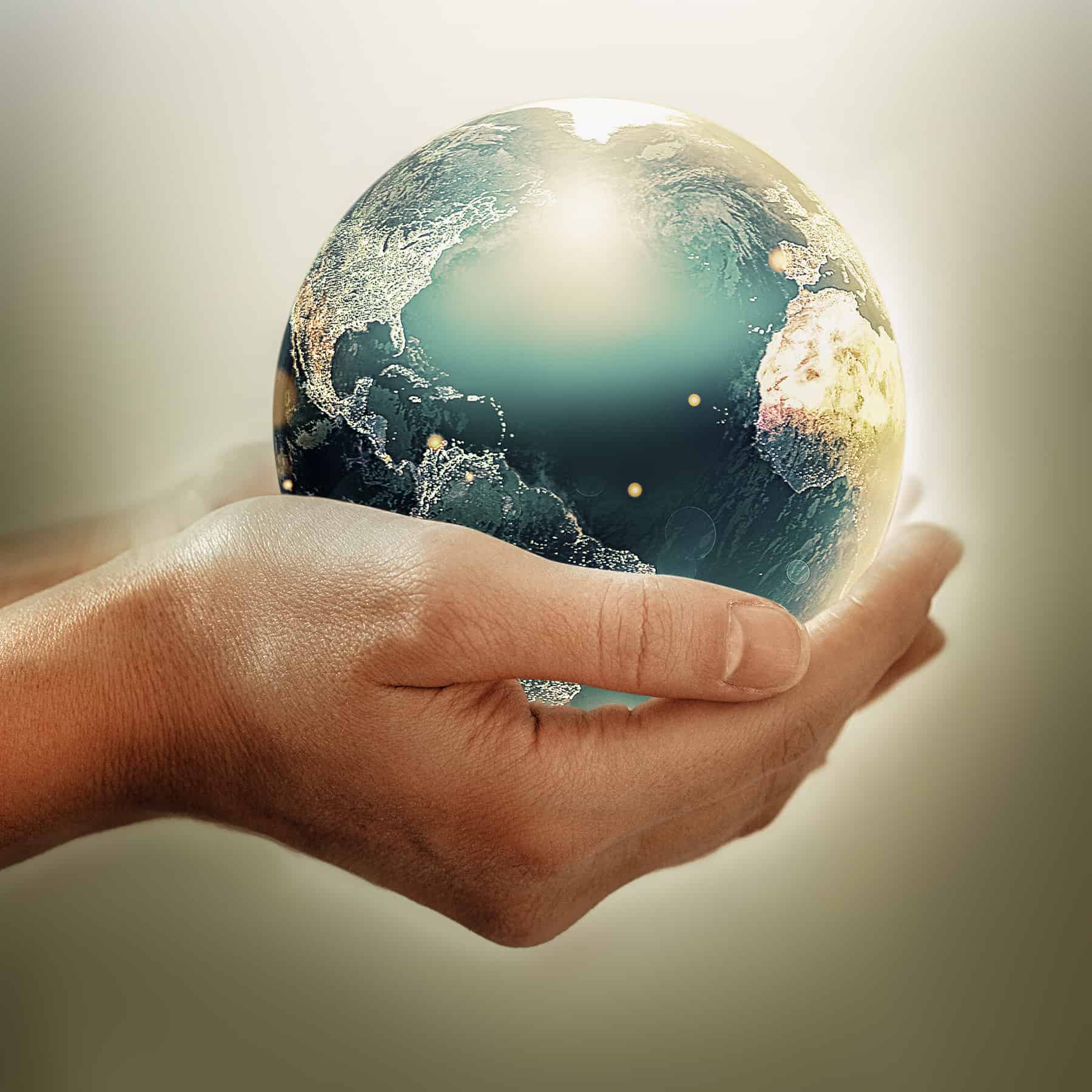 Hands holding earth - conceptual image of the earth day, saving energy, protecting the environment. Elements of this image furnished by NASA