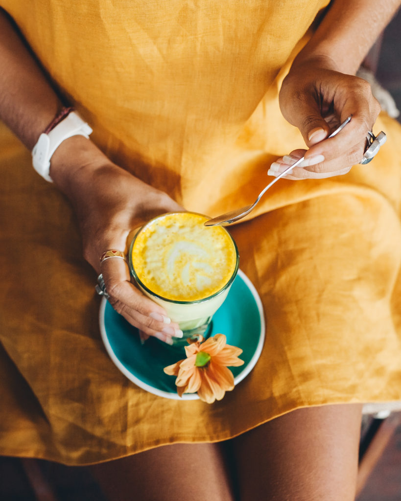 Girl with Golden Milk Turmeric Latte